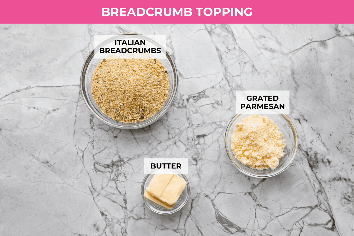 Craving chicken parm? Grab a spoon! This chicken parmesan soup is loaded with tender chicken, pasta, and a rich, creamy tomato broth. Finish with crispy, buttery breadcrumbs for a delicious twist on the Italian classic! Overhead shot of labeled breadcrumb topping ingredients.
