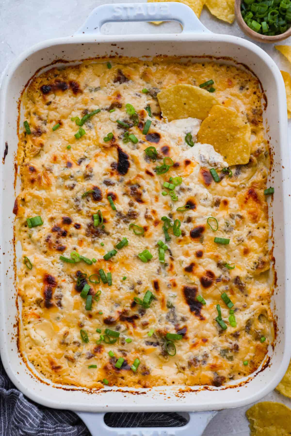Top down shot of hissy fit dip garnished with green onions. 